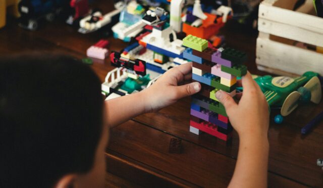 child playing with lego blocks